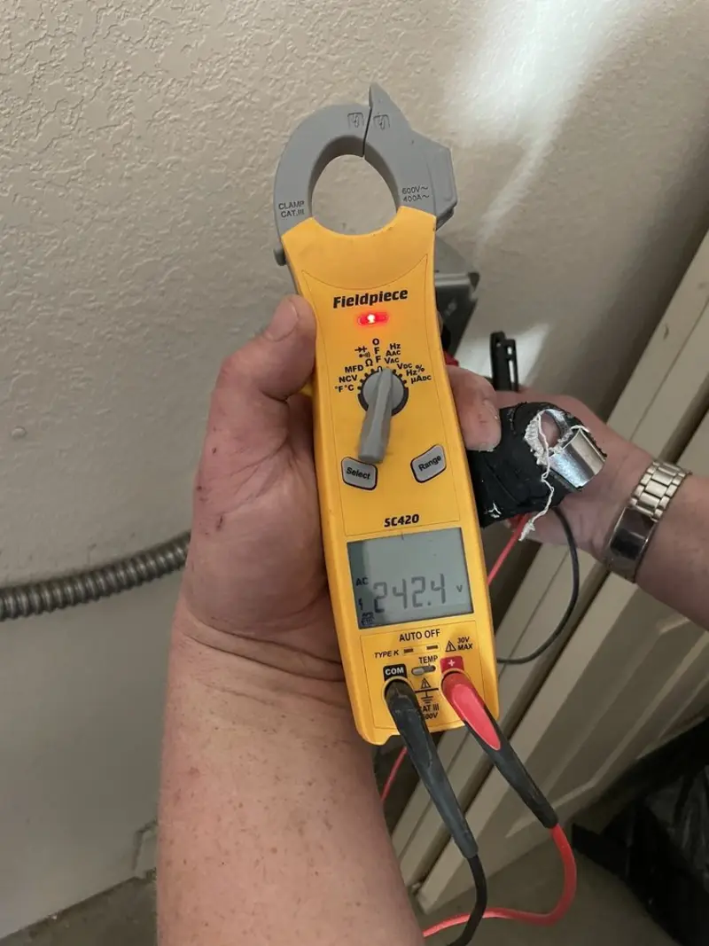 Voltage testing with clamp meter during Whole House Surge Protector in Troy